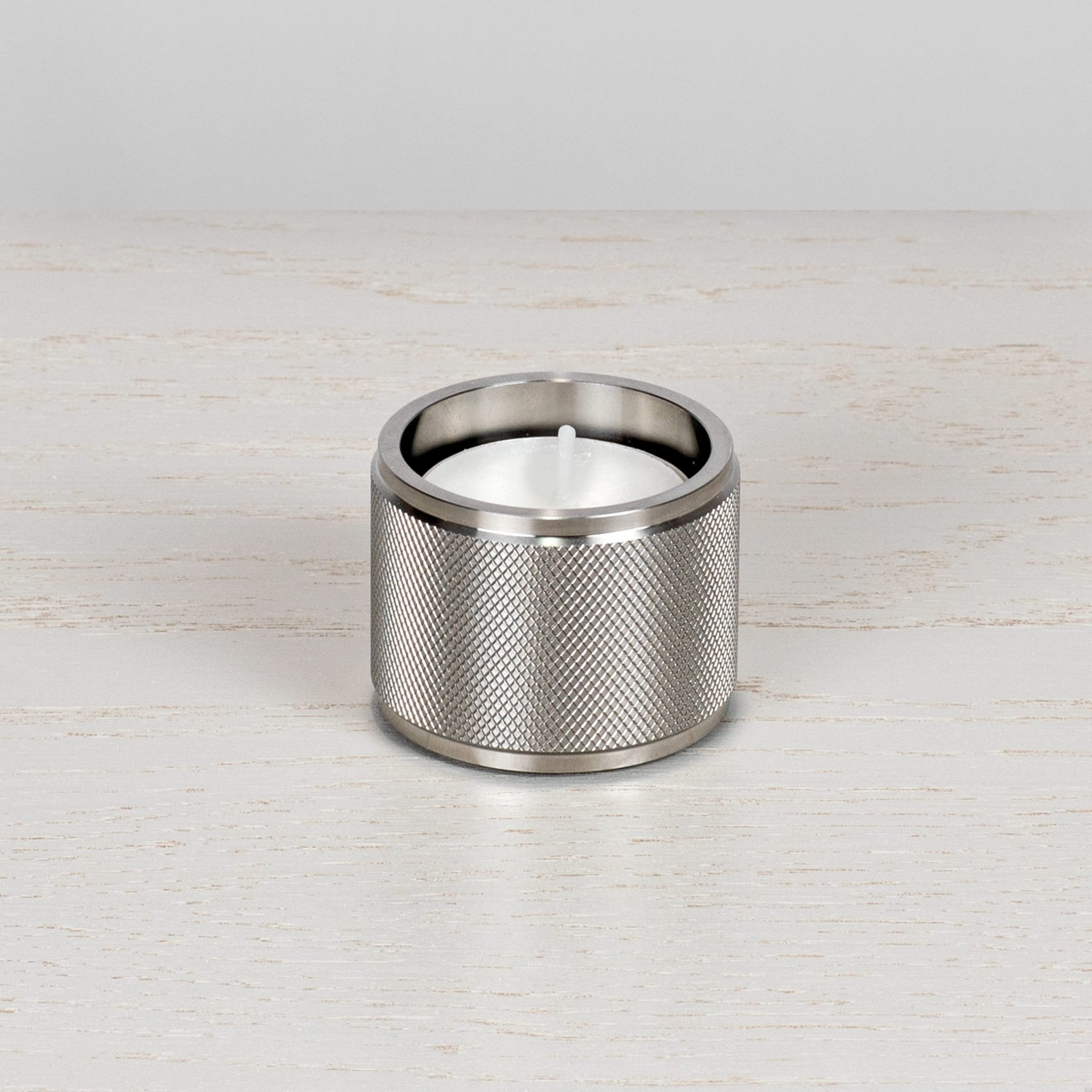1.-BusterPunch_Tealight_Candle_Holder__Steel_Front_off-scaled.jpg