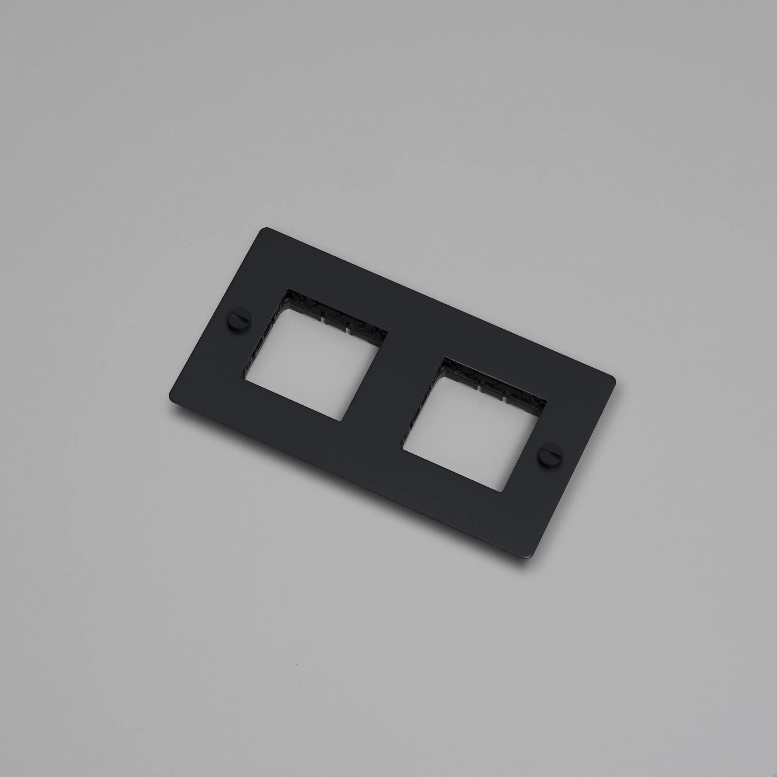 EU_ELECTRICITY_2G_Wall_Plate_No_Infill_Black_Web-scaled.webp