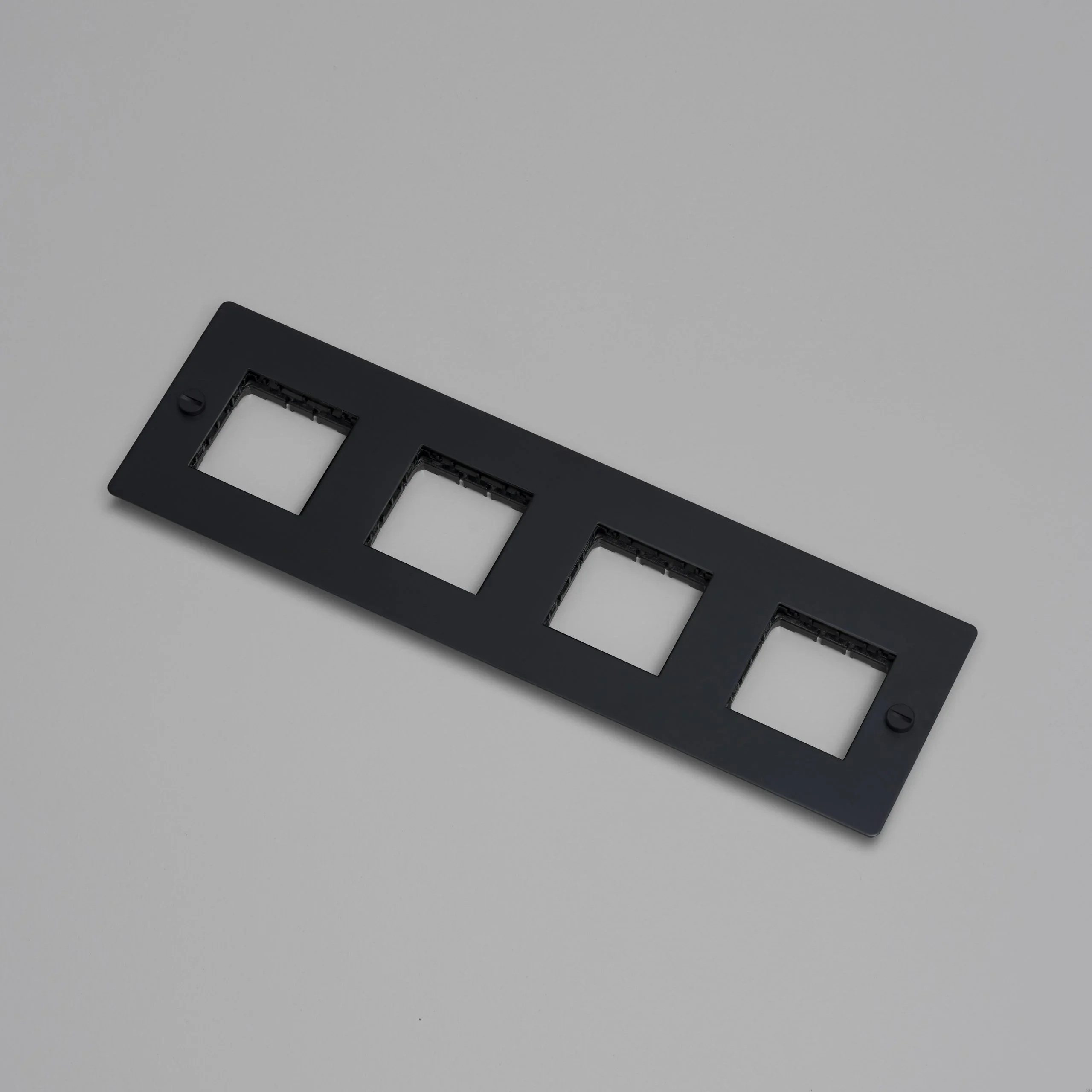EU_ELECTRICITY_4G_Wall_Plate_No_Infill_Black_Web-scaled.webp