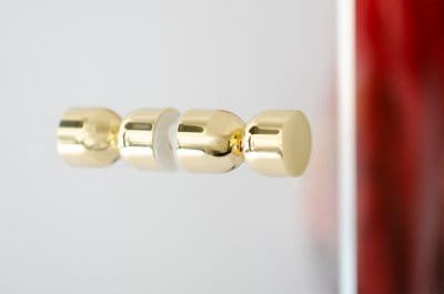 Ручка мебельная двусторонняя Kokeshi 1832, полированная латунь, без лака.